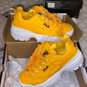 Yellow Fila disruptors